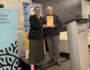 Megan Chorlton accepting an AMBC #OurAssetsMatter award on behalf of MIABC.